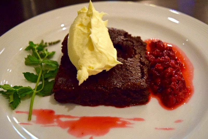 Chocolate brownie with redcurrant sauce at Villa Mansa Hotel