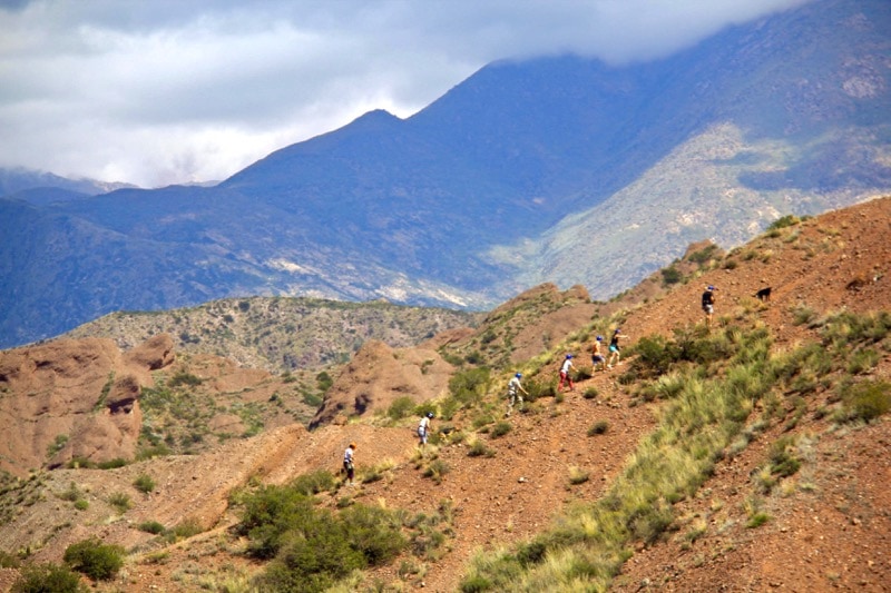 Hiking up to the first spot to zipline over the Andes in Argentina