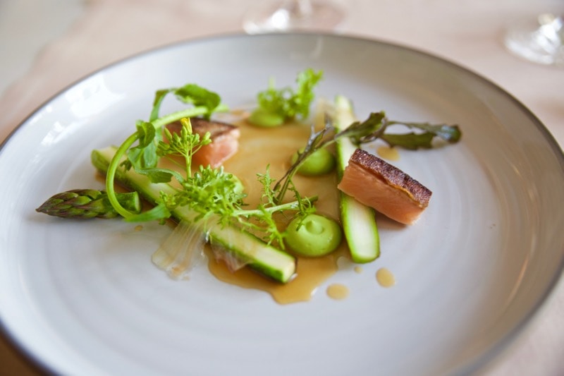 Pan-fried arctic char with asparagus, broccoli puree and browned butter sauce at Olo Restaurant, Helsinki