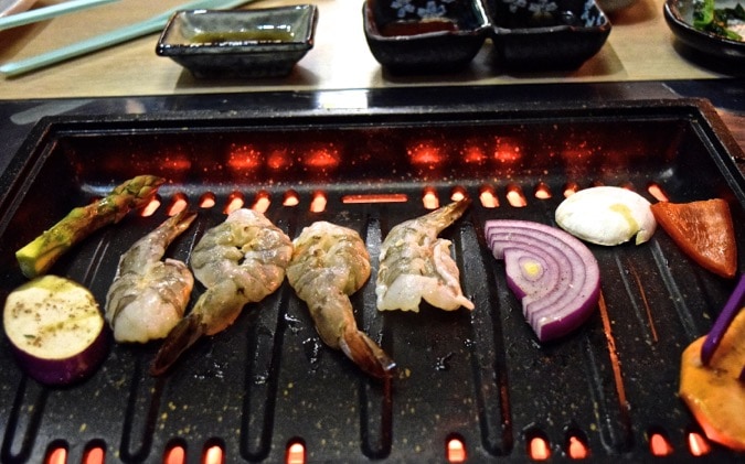 BBQing our food at SuperStar BBQ - Korean restaurant in London