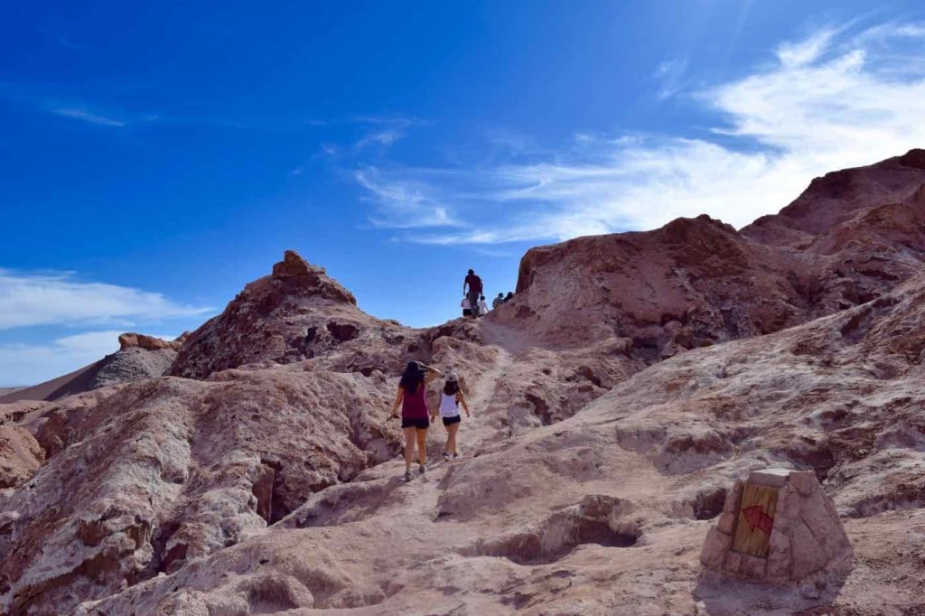 Climbing up the rocks by the salt caves, Atacama