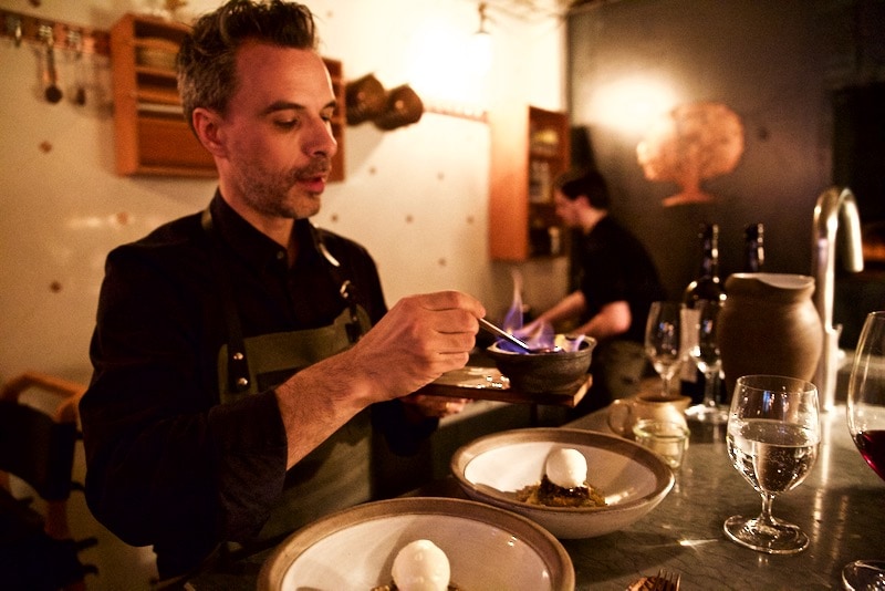 Sommelier Max flambeeing dessert at Ekstedt Restaurant, Stockholm 