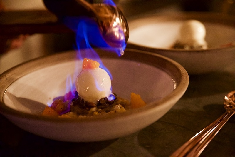 Flambe pumpkin cake dessert at Ekstedt Restaurant, Stockholm