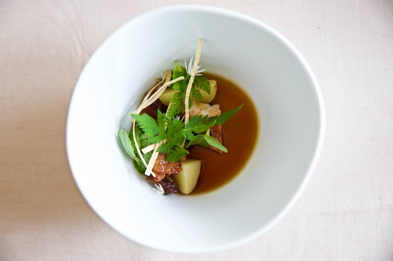 Sweetbreads of veal with new potatoes, nettle puree and oxtail stock at Olo Restaurant, Helsinki