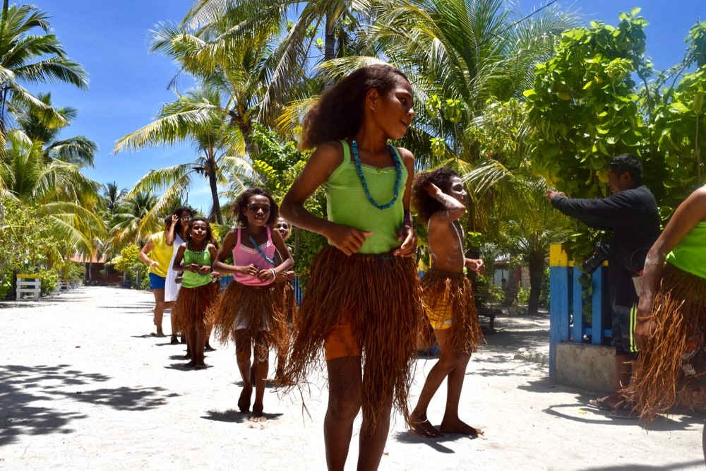 Kids dancing in Arborek Village, Raja Ampat