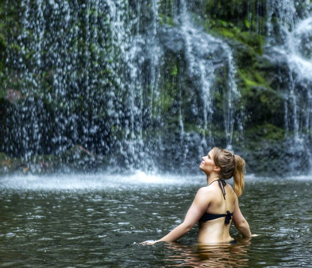 Swimming in a waterfall in Hawaii