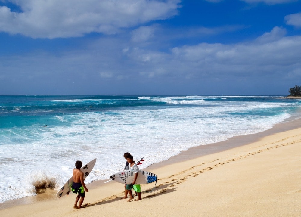 Surfers on Hawaii's North Shore