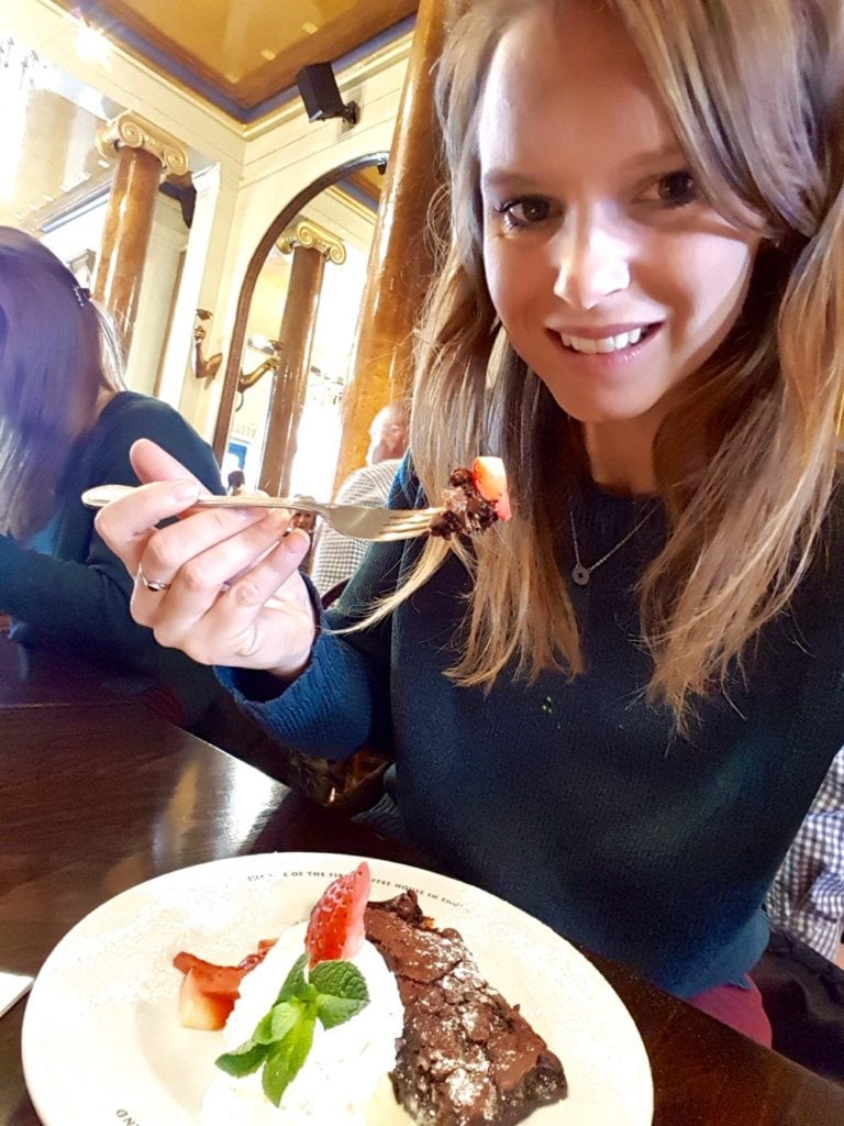 Tucking into a chocolate brownie at The Grand Cafe, Oxford