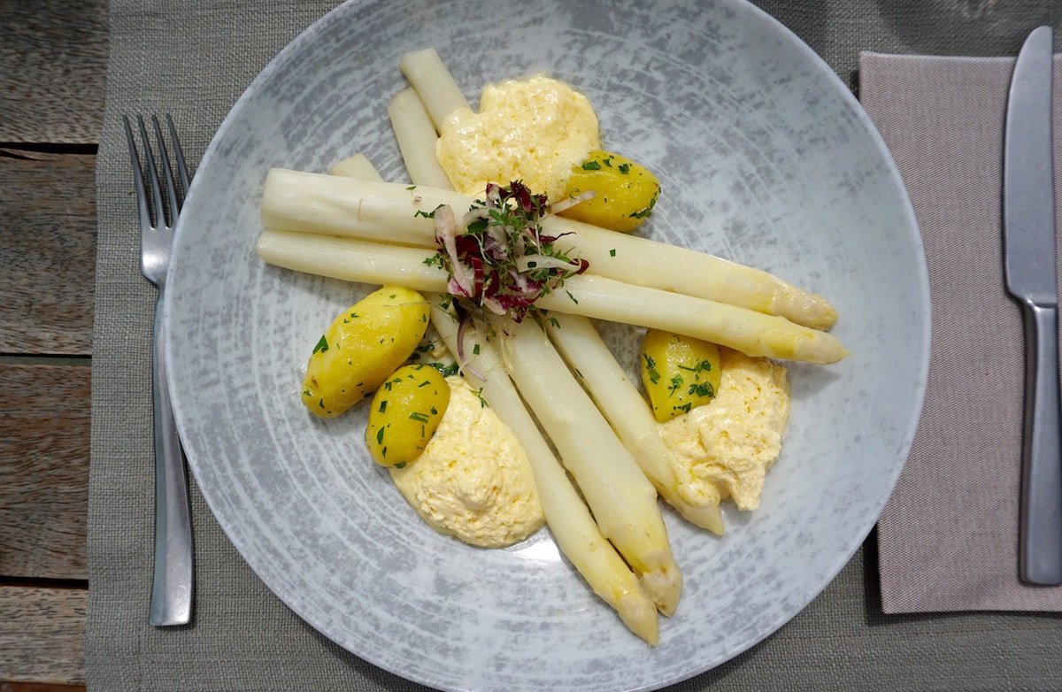 Seasonal white asparagus with bernaise at Aiola Upstairs in Graz, Austria