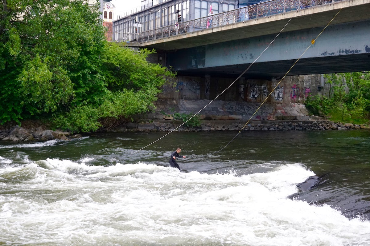 Top things to do in Graz Austria - watch surfers on the River Mur