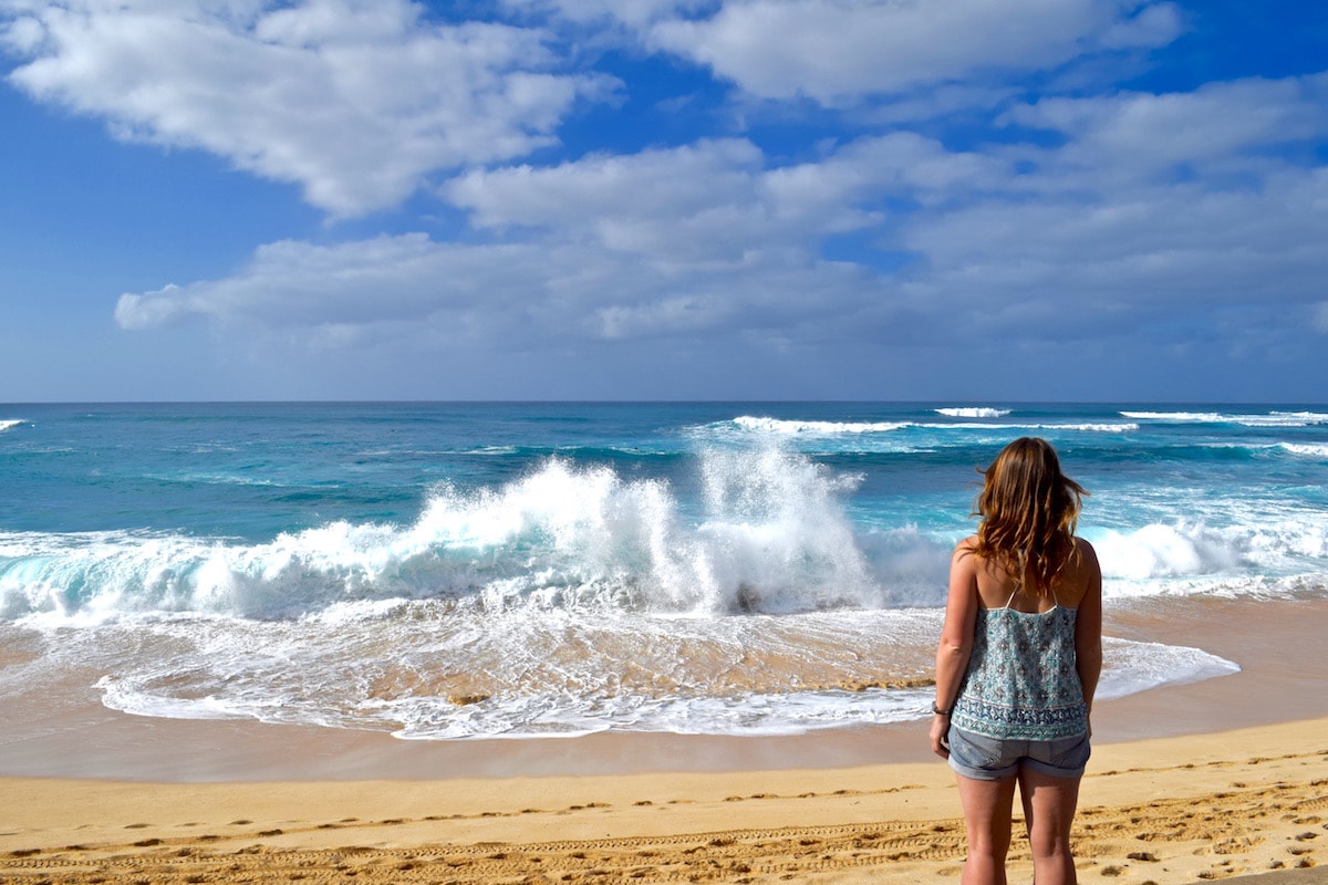 Watching surfers on the North Shore, Hawaii