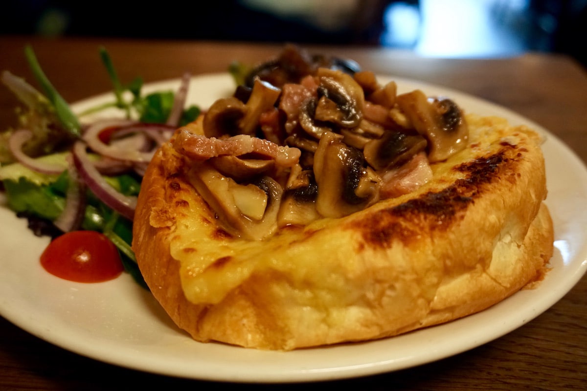 Sally Lunn bun topped with the welsh rarebit special