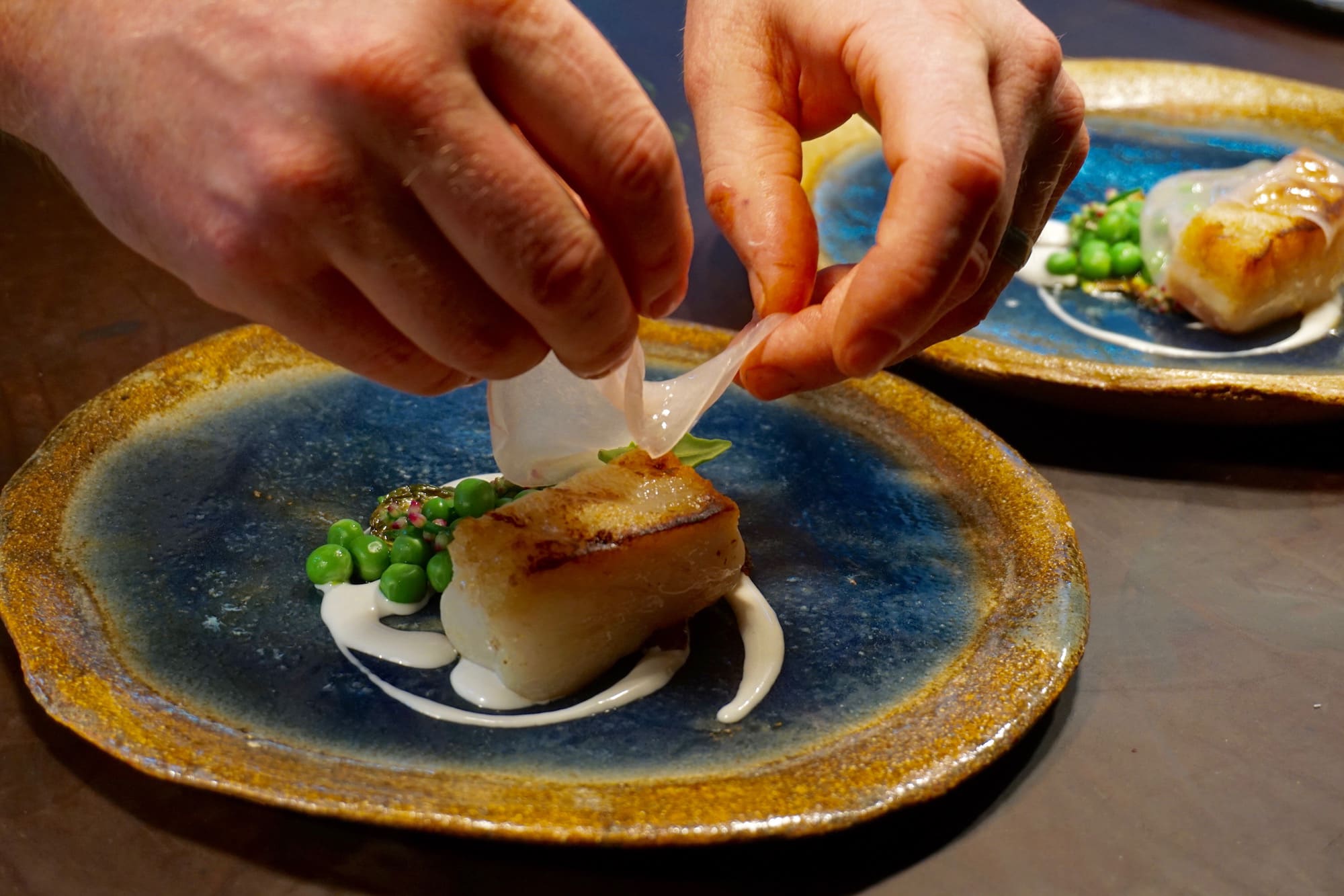 Chefs preparing the cod dish at The Forest Side