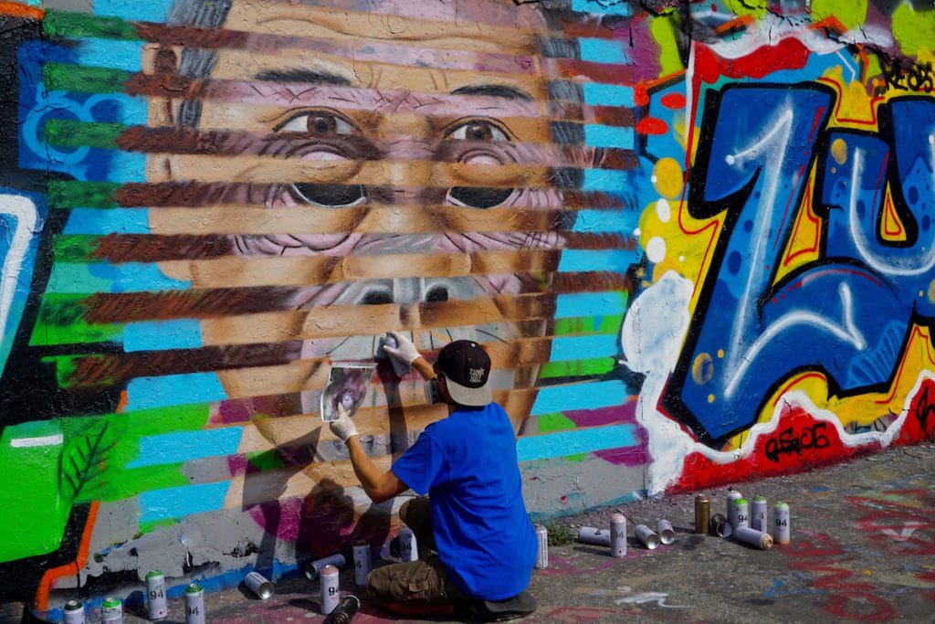 Street art in action at Mauerpark Berlin