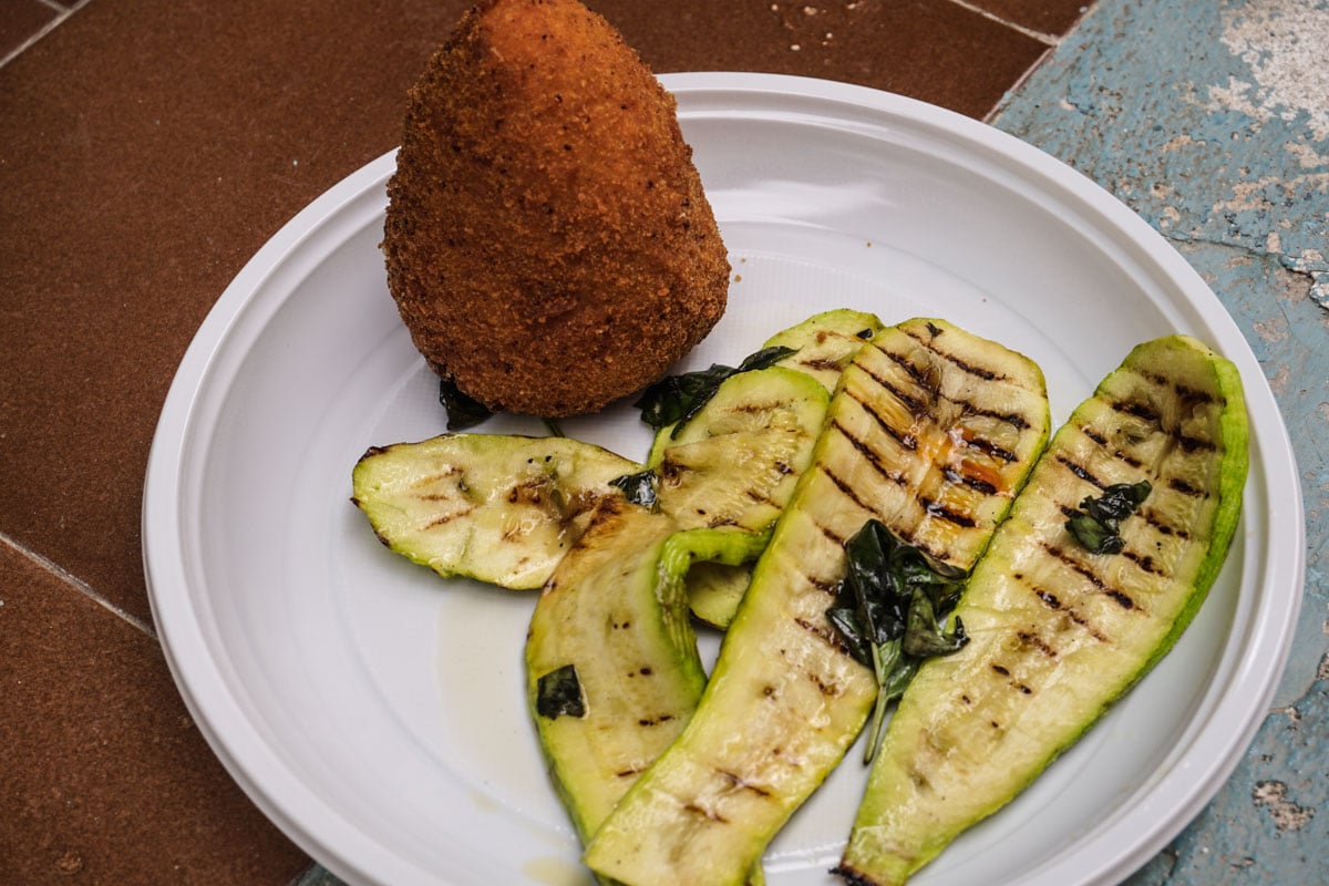 Tasty arancini and courgette salad in Salina, Sicily