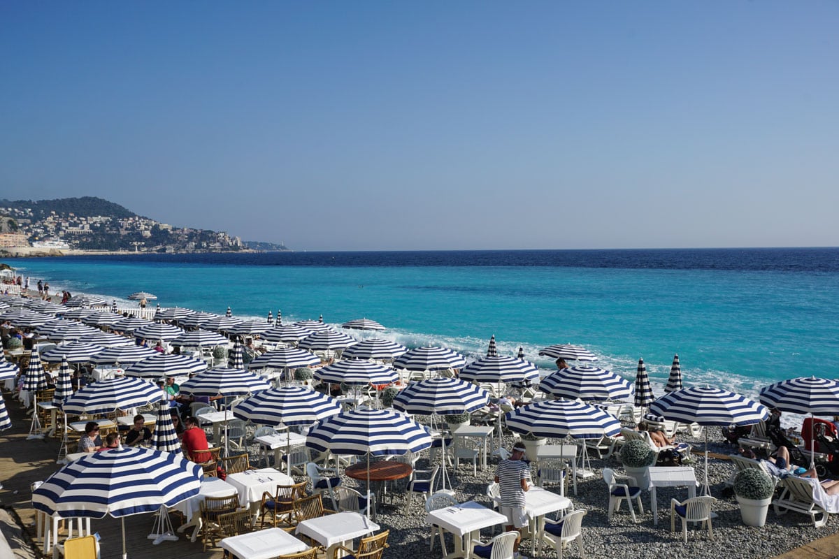 Stripey umbrellas on the beach in Nice