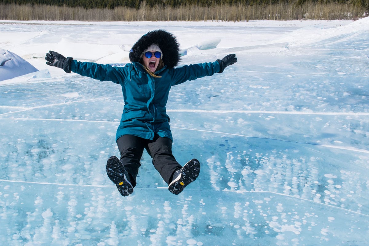 Sliding over the ice bubbles on Abraham Lake, Canada