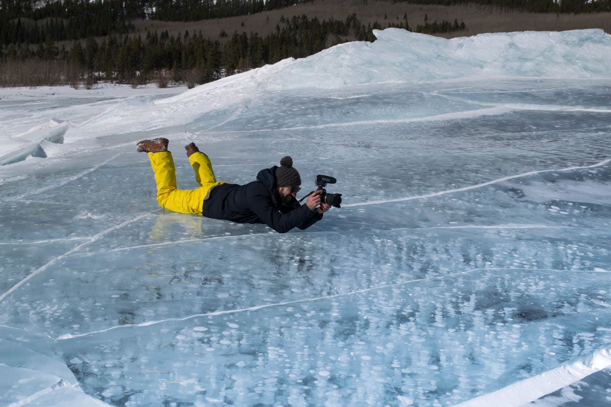 Enjoying the ice bubbles on Abraham Lake, Alberta, Canada