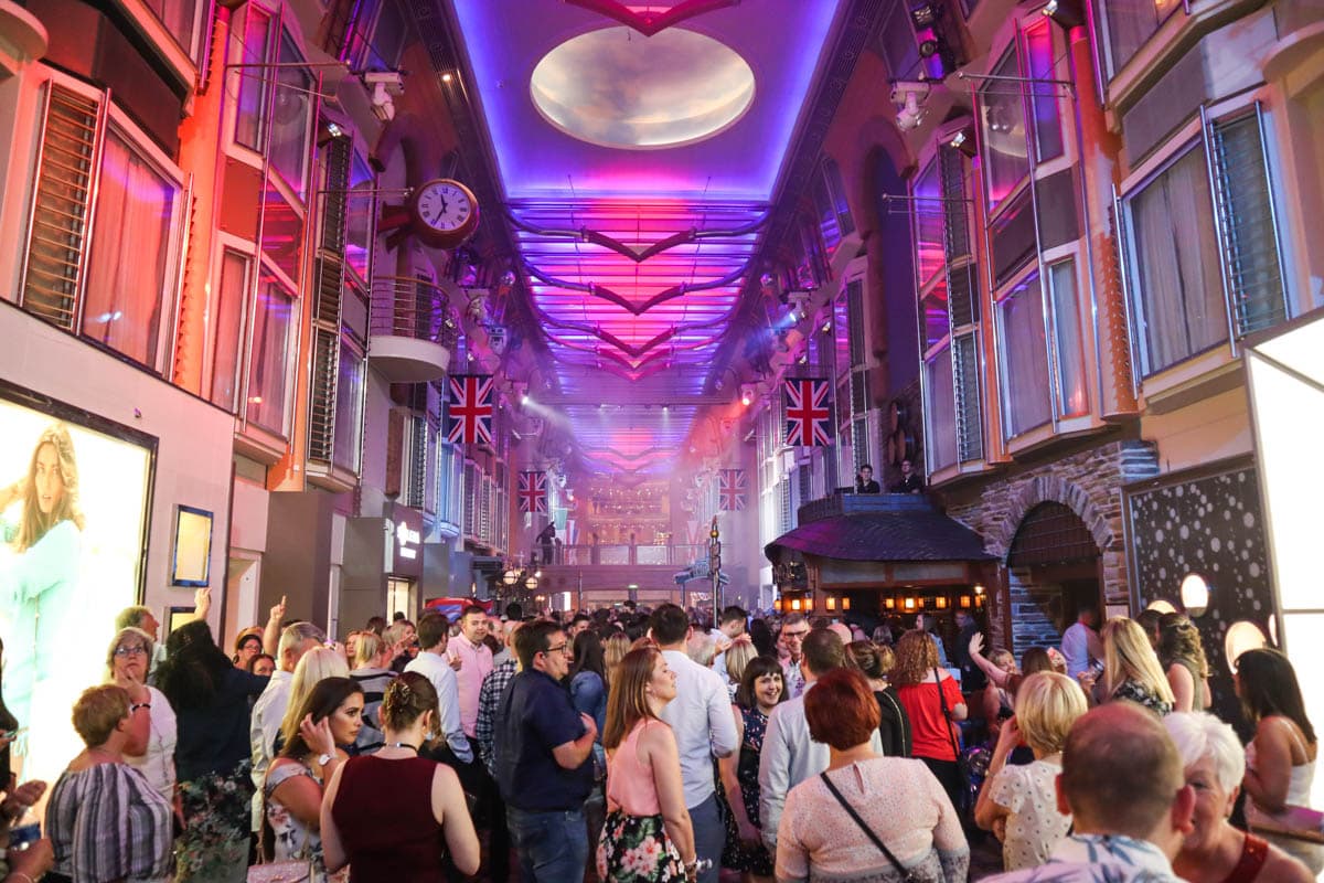 View along the main promenade at night on Royal Caribbean Independence Of The Seas