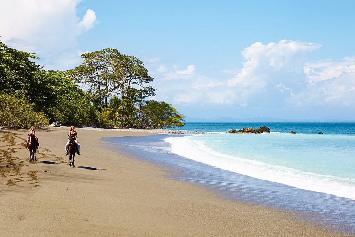 Horseback riding on the beach near Lapa Rios ecolodge