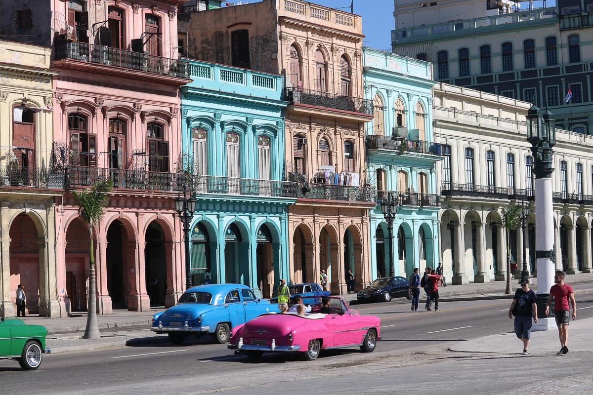 Vintage cars and colourful buildings on the Malecon, Havana