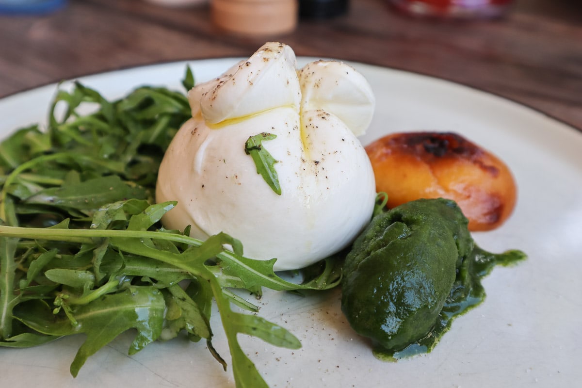 Burrata with rocket, basil sorbet and nectarine at Salonplafond, Vienna