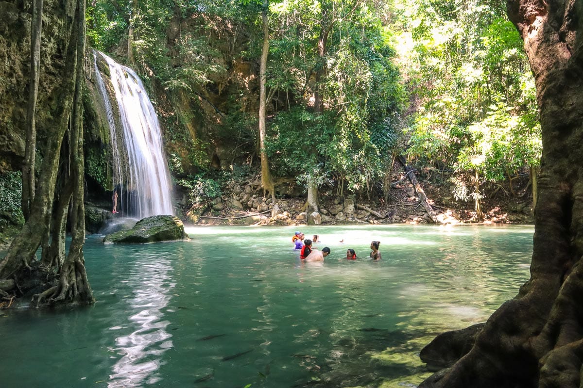 Swimming at Erawan Waterfalls, Thailand