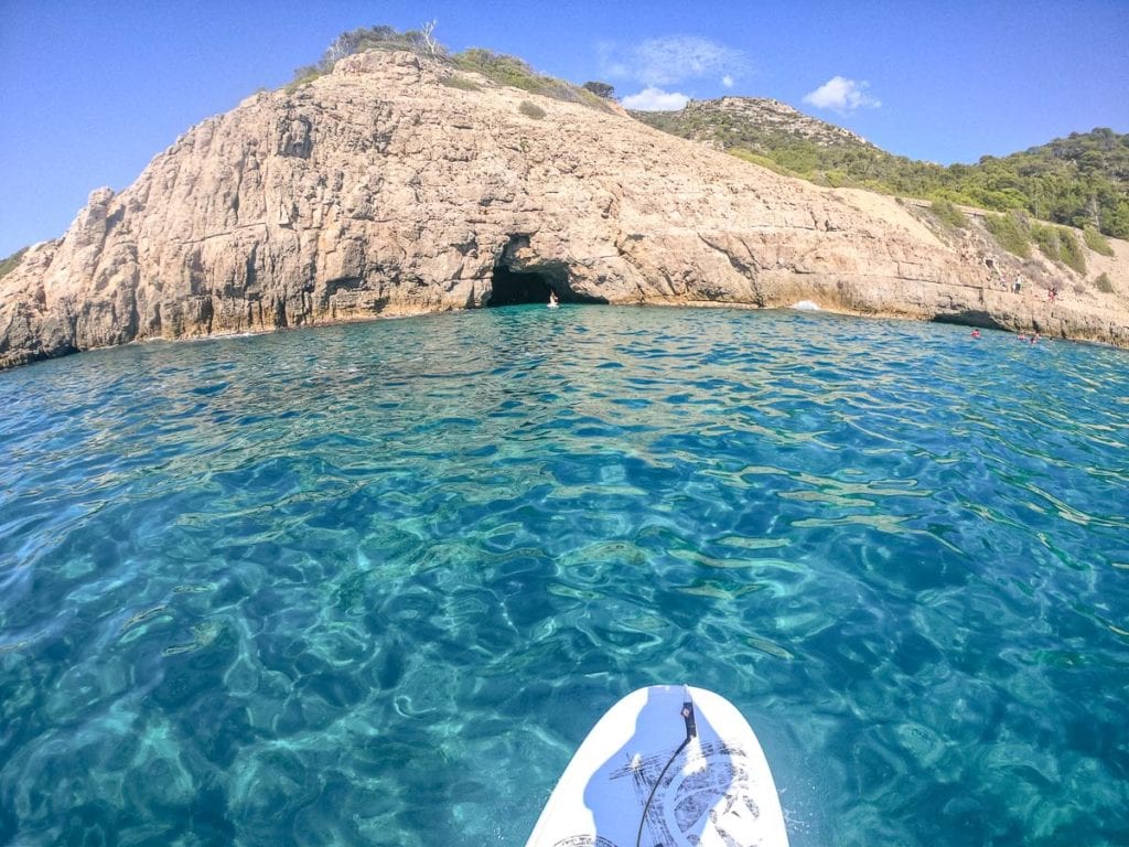 Paddle boarding to Cova del Llop, Catalonia