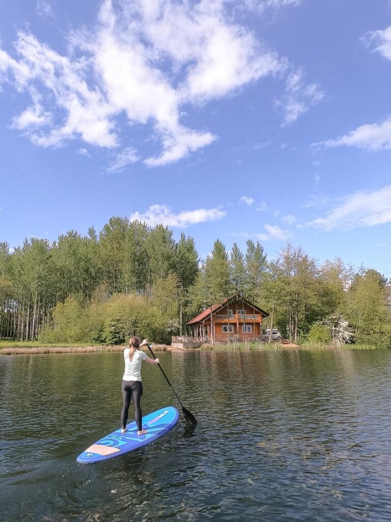 Paddle boarding at Log House Holidays in the Cotswolds