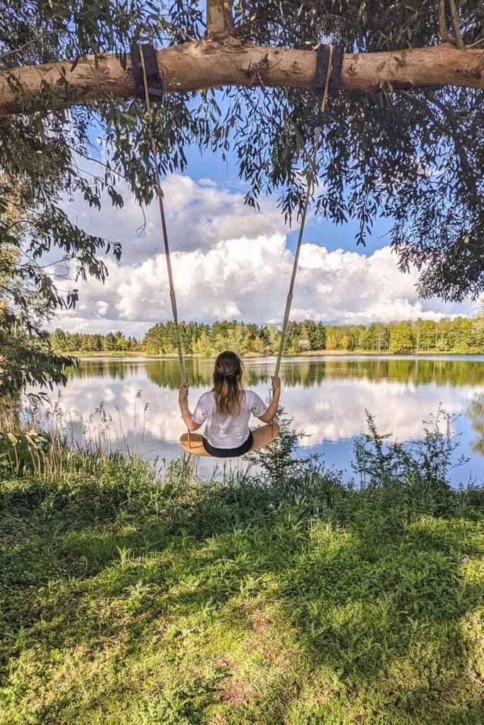 On the swing at Log House Holidays in the Cotswolds