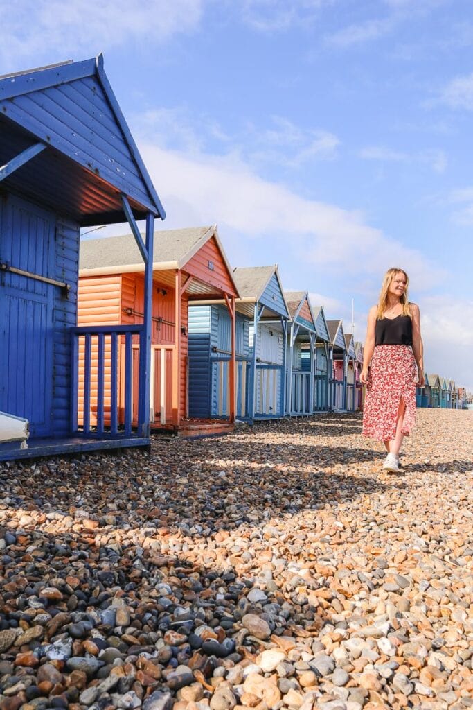 Walking past the beach huts in Herne Bay