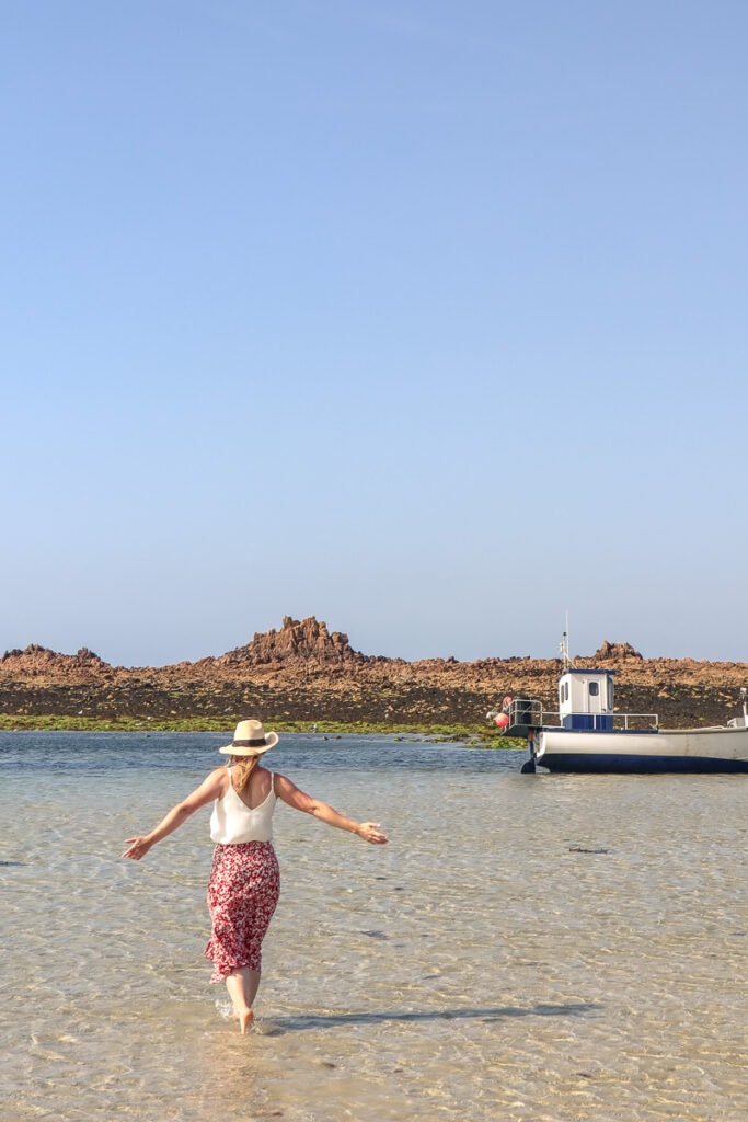 Paddling in Cobo Bay