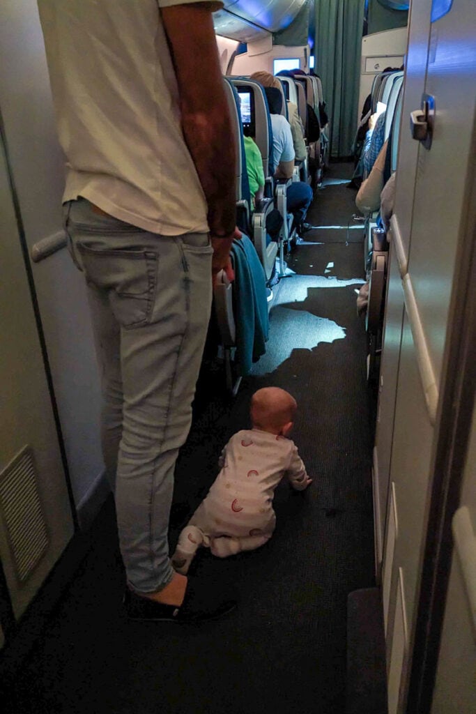 baby crawling on plane