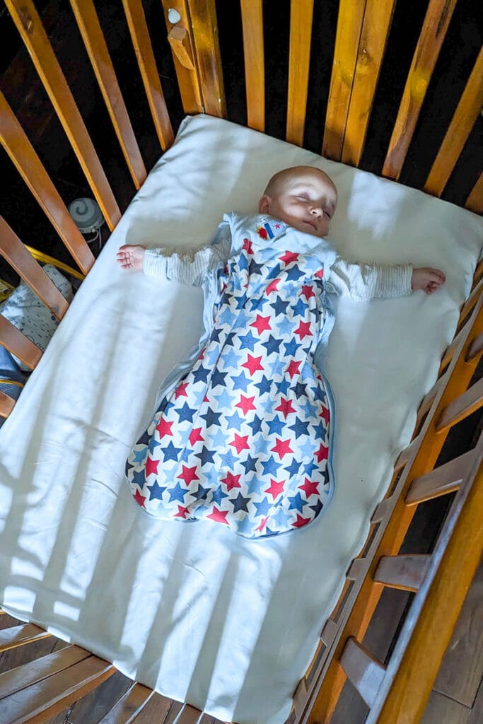 baby sleeping in cot