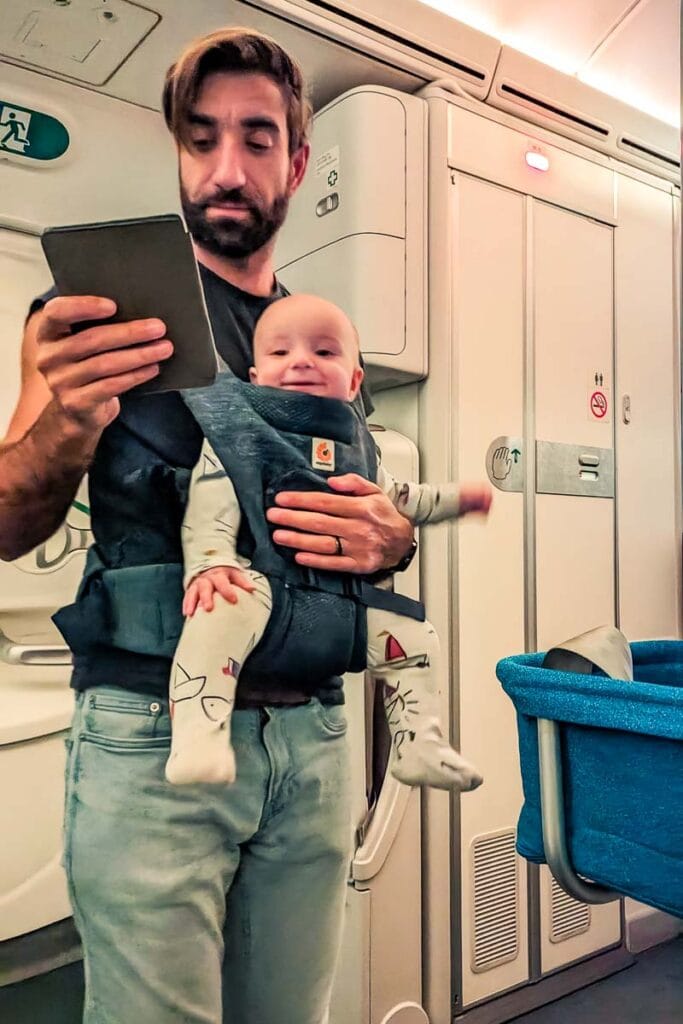 baby in a carrier on plane