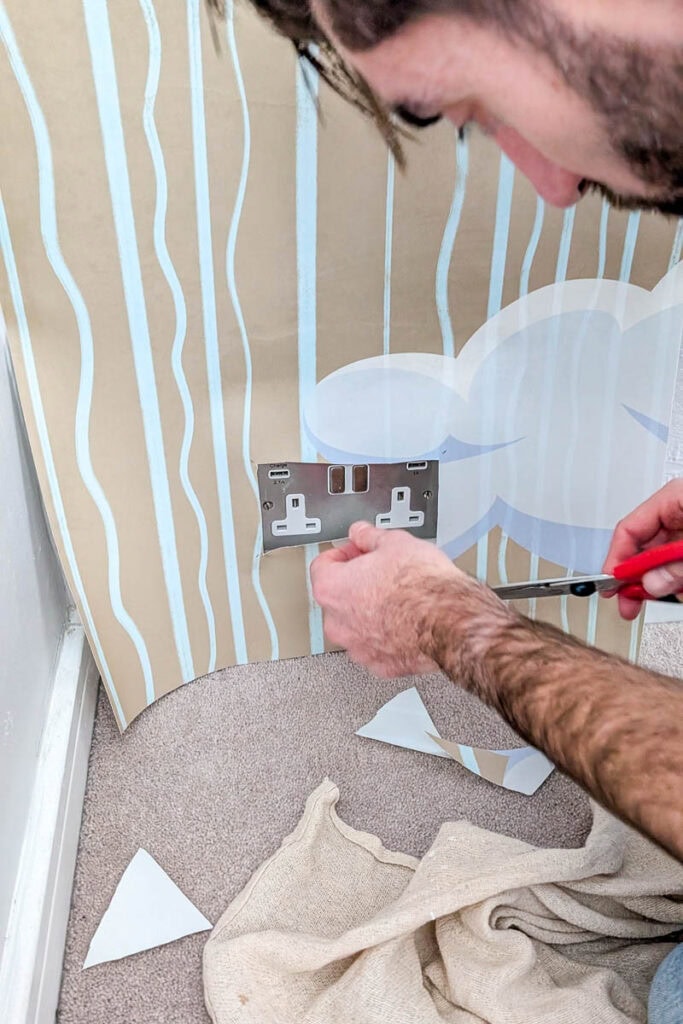 hang wallpaper around plug socket