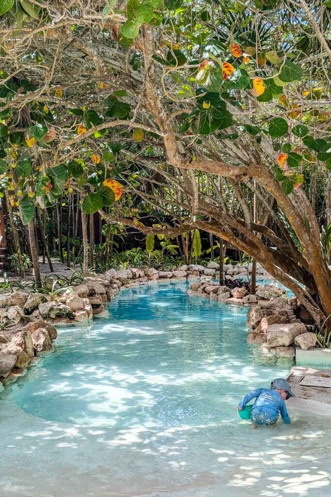 child playing by swimming pool in mexico